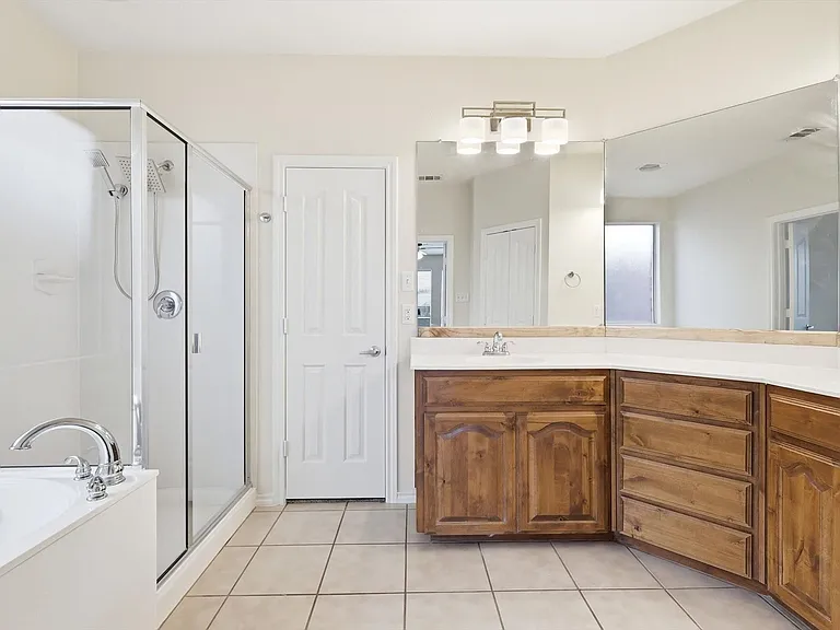 And the primary bath area. Separate shower and tub,double vanities and so many mirrors for your comfort.