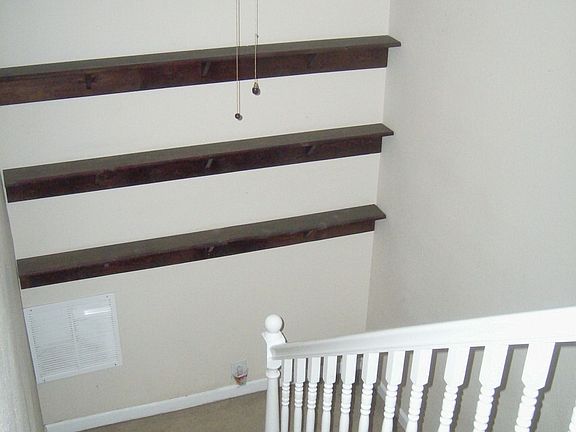 stair case with shelves for your family photos!