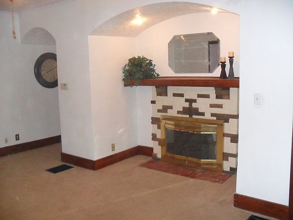 living room + beatiful restored hardwood floors (floors have been polyurethane