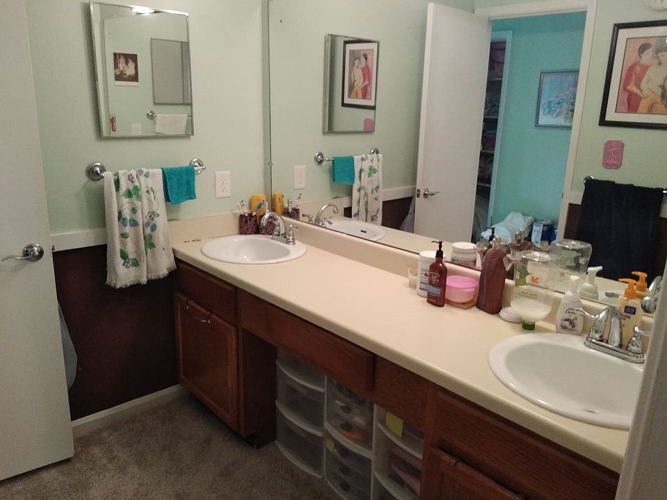 Double sink in a seperate room from Toilet/tub