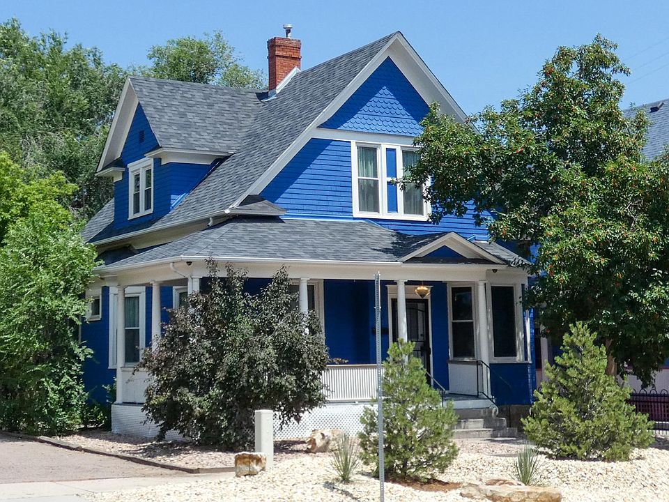 Front of house. Wrap around Victorian front porch.