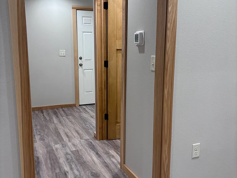 Hallway to bathroom, bedroom and back door