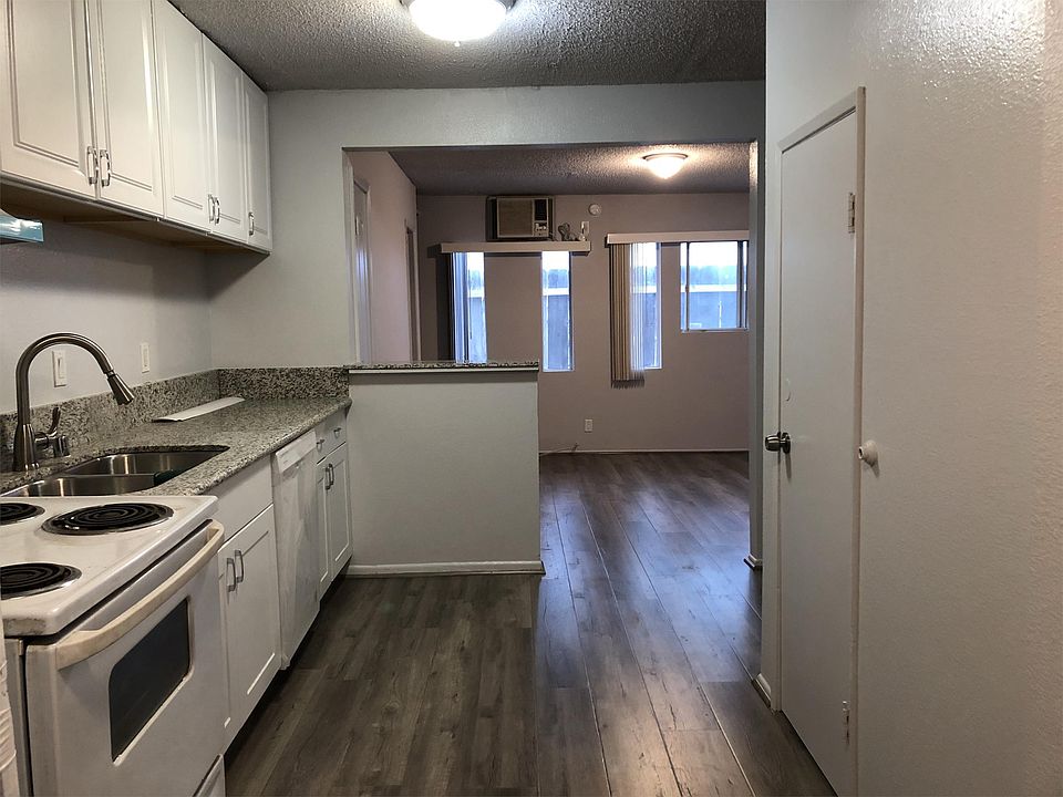 Beautiful view of the unit from the front door. Notice new flooring, new paint, and new countertops