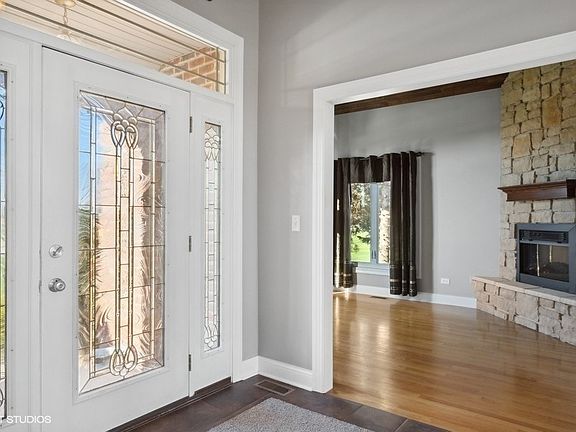 Living room or office space.  Stone and electric fireplace make this space cozy and inviting.