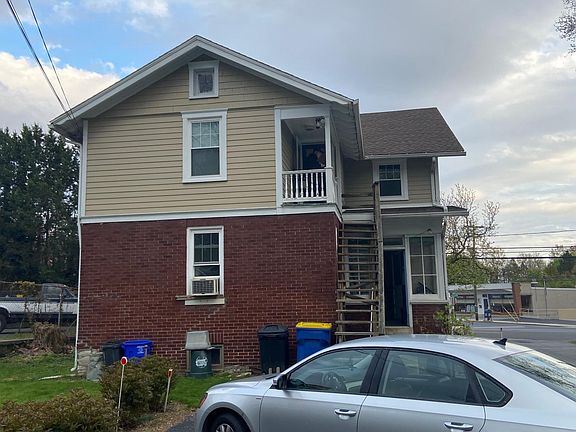 Rear of apartment has small porch