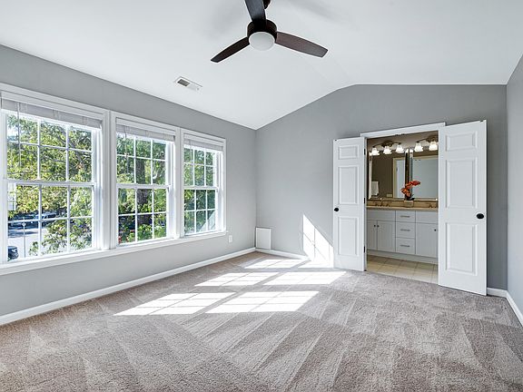Primary bedroom on top floor with ensuite bathroom and walk in closet