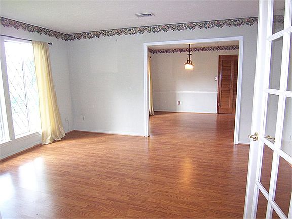 Formal living room off entry with French doors also makes a great study!