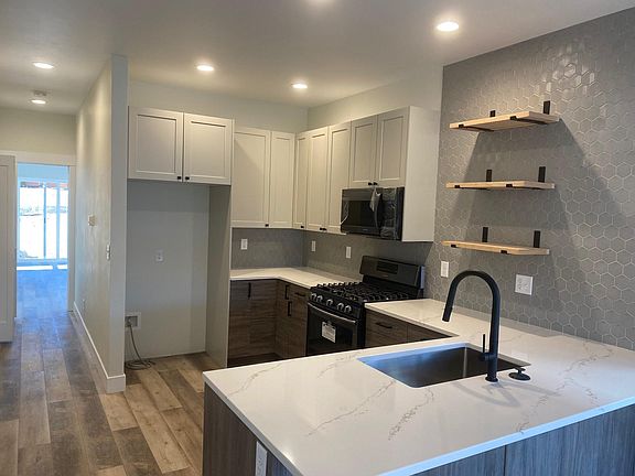 Beautiful kitchen (note photo was taken prior to refrigerator being delivered). Includes all appliances.