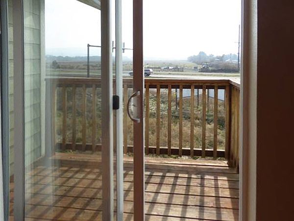 Upstairs unit private balcony.