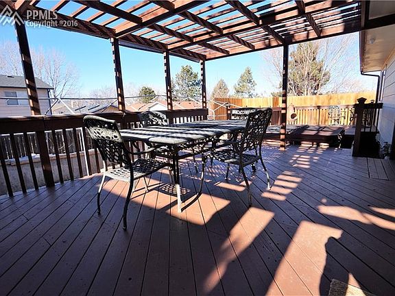 Huge deck off of dining room has custom pergola, hot tub and additional 12'x12'