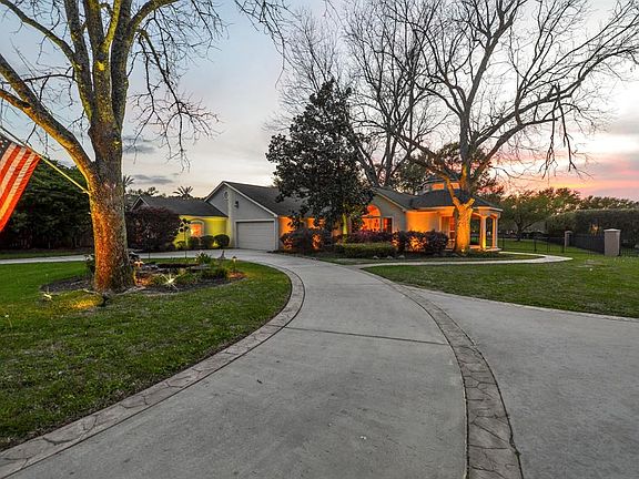 Welcome home! The gated subdivision entrance and the gated driveway provide extra security when driving up to this beautiful home.