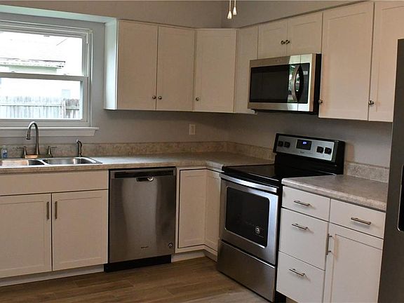 Beautiful eat-in kitchen with gorgeous new cabinetry, stainless appliances & countertop.  You will love the flooring, too.  Just move in!