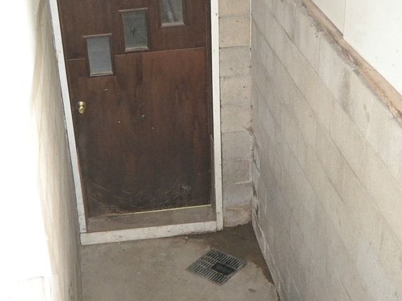 The entrance to the basement is through the attached garage.  Nice wide staircase with straight access that would make it easy for moving furniture or pool tables.