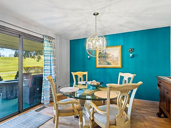 Spacious formal dining area spills out onto the adjacent patio.