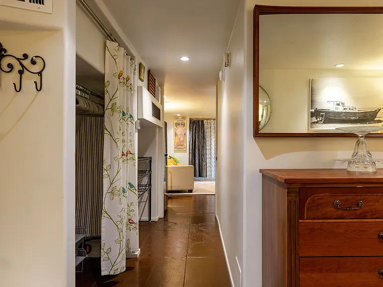 Hall View with Large Hanging Closet and Pantry on the Left