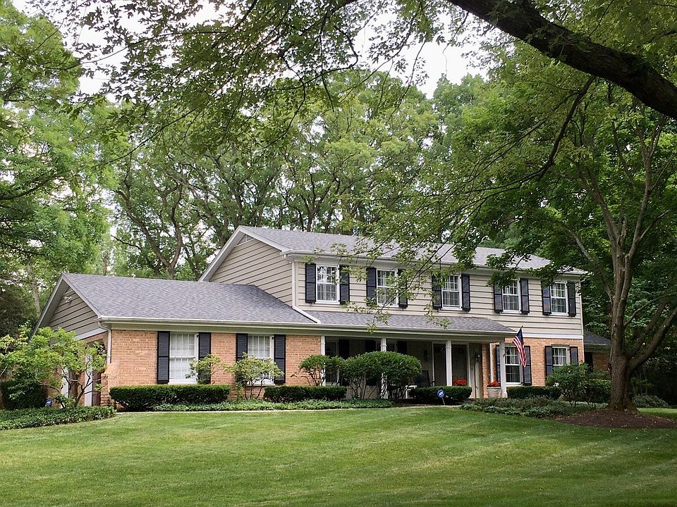 Eye-catching Colonial poised on a sweeping .5 acre property