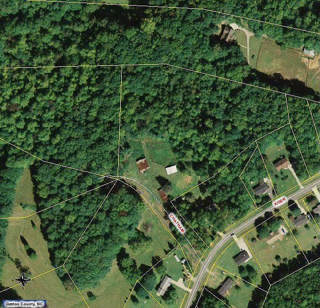 Land in the center red roofed barn