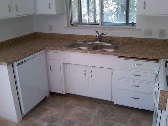 Kitchen with new sink, faucet and dishwasher