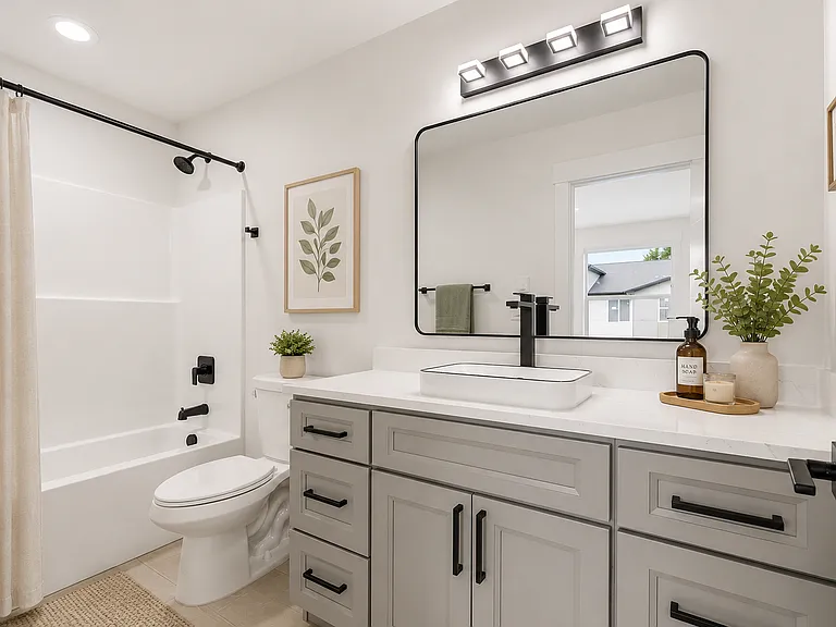 Primary en-suite bathroom. 

Photos may include AI-generated virtual staging to help visualize the home's potential. Finishes and layout remain unchanged.