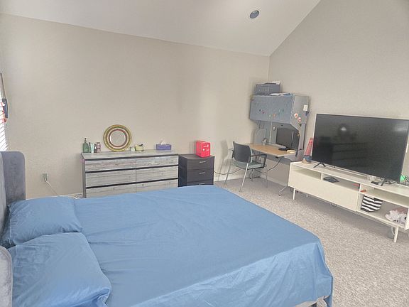 Master bedroom, Samsung Smart TV, office desk.