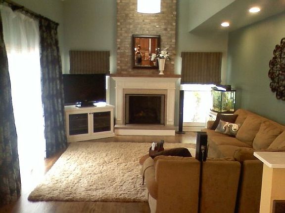 Wood floors, tiled fireplace