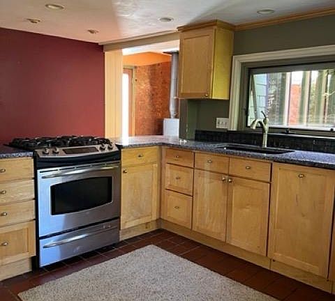 Kitchen with modern appliances and unique recycle glass countertop