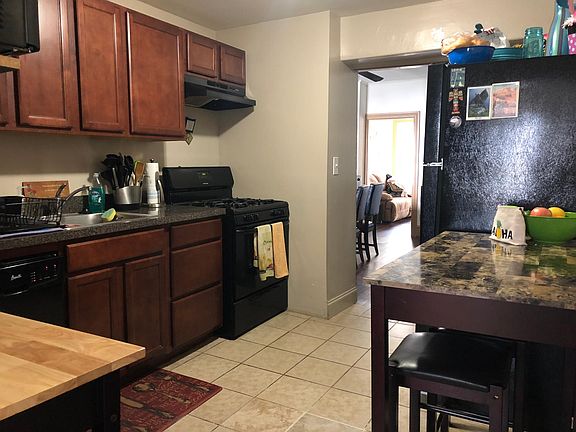 Kitchen, all black appliances including range, refrigerator,