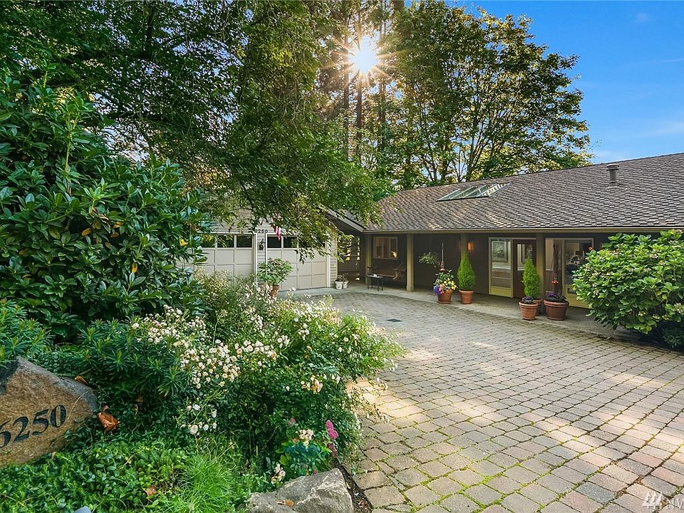 Lush landscaping and paver-stone driveway welcome you to this 3530 SQ FT, 4 bedroom 3 bath home resting peacefully on a 14,248 SQ Ft lot.