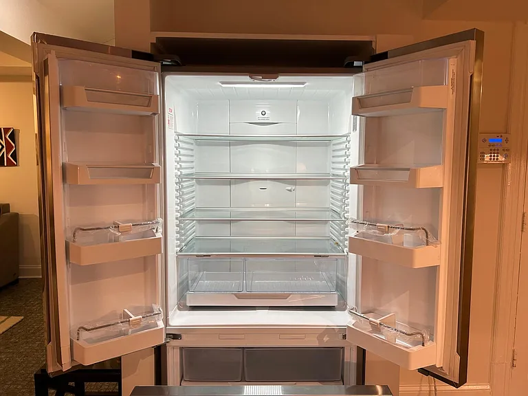 Fisher Paykel French door bottom freezer refrigerator with built-in filtered ice maker.