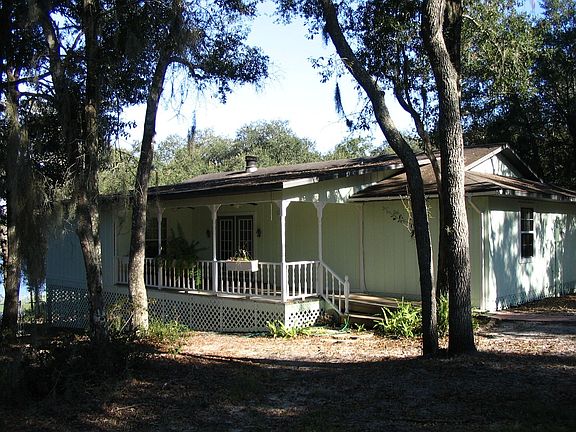 Front of house with porch and trees
