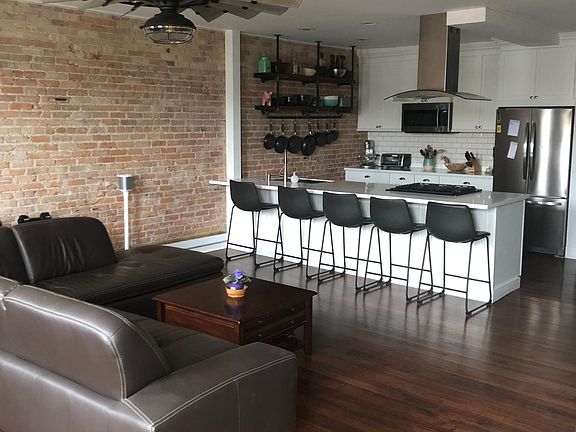 Great room with exposed brick