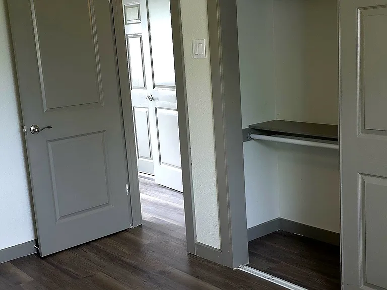 2nd bedroom with large closet and ceiling fan