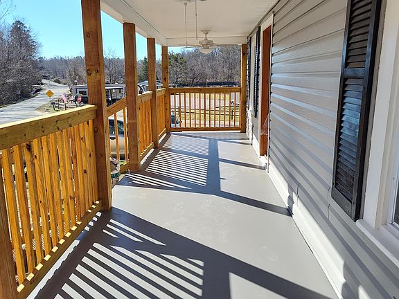 Front porch complete with ceiling fans and lights. Views of the river!
