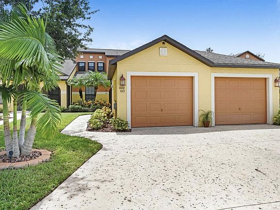 Garage on left side and full driveway.