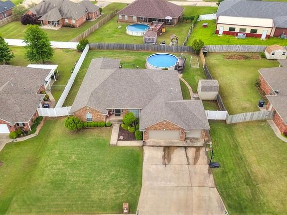 Aerial view of the home and back yard.