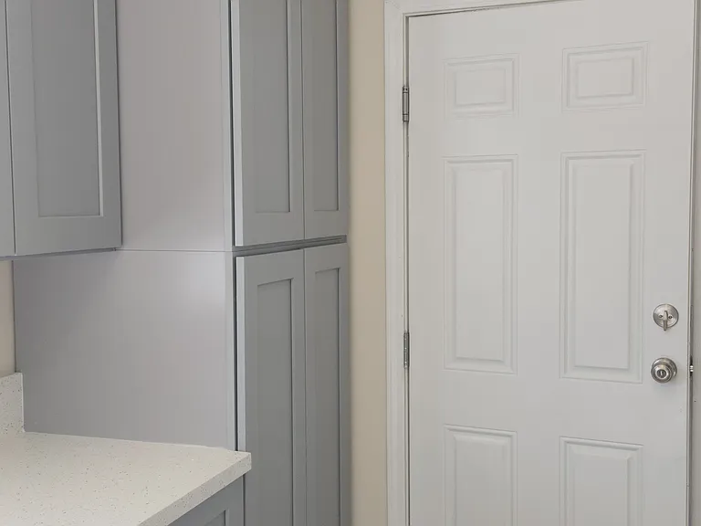 Kitchen pantry. Door to the garage