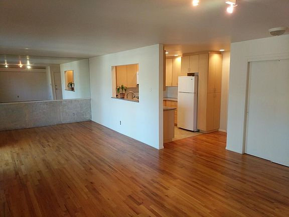 Living/Dining/Kitchen with full wall mirror