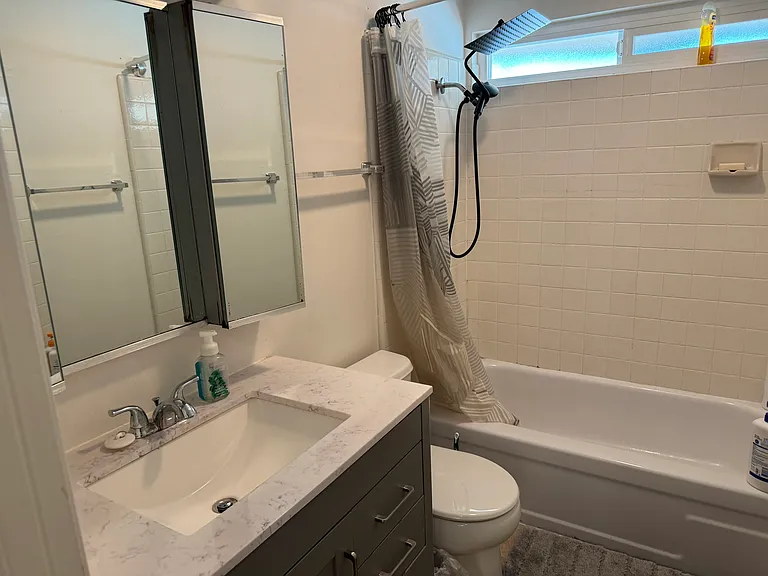 Upstairs shared full bathroom with two entrances.