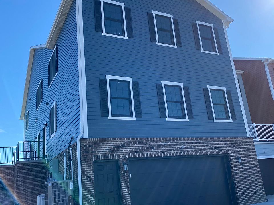 Side and garage entrance, heated stair well.