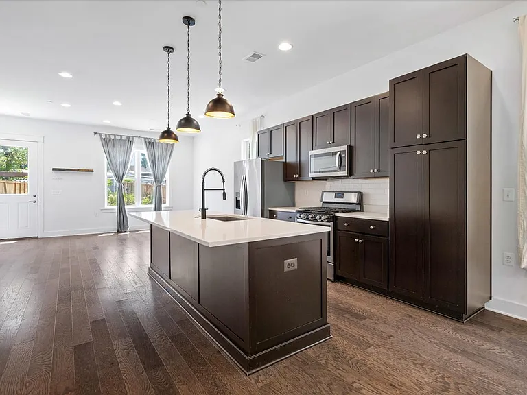 Stone countertop with overhang to put barstools for entertaining or a casual breakfast