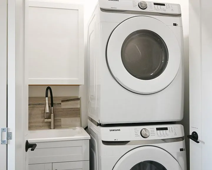 Waher and dryer with sink at Lyric Townhomes.