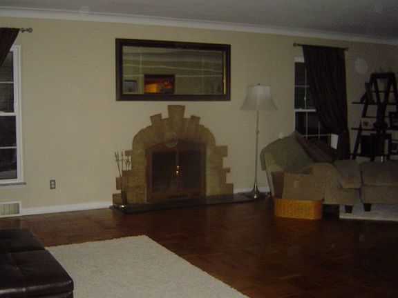Living room with stone fireplace