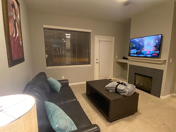 living room-gas fireplace/private patio with southern unobstructed views of Mt Rose