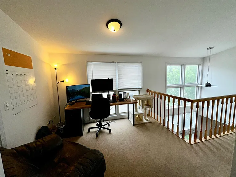 LOFT/OFFICE/WORKOUT AREA OVERLOOKS DINING AREA BELOW. VERY DRAMATIC AND SOUTH SUN