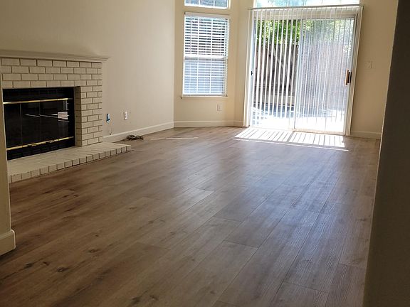 full view of living room from entry way & sliding glass door