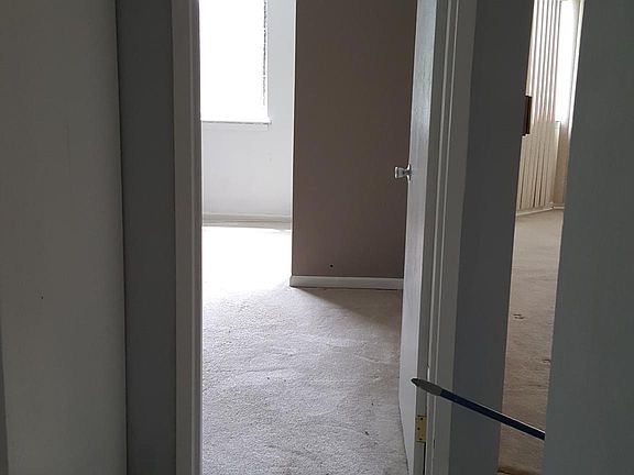 Hallway with closet on the left.