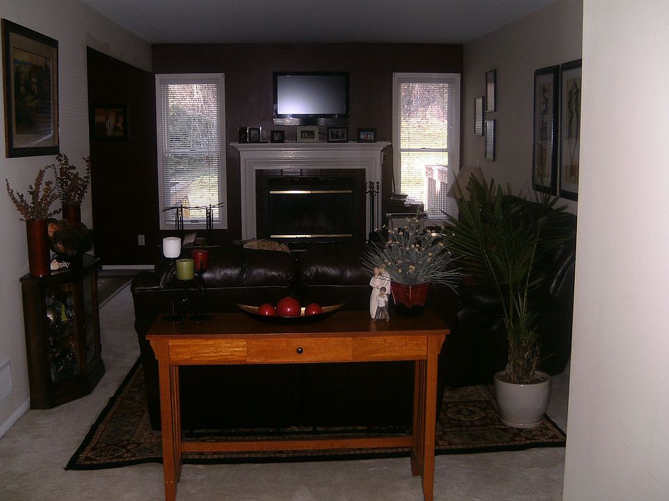 living room with wood burning fireplace