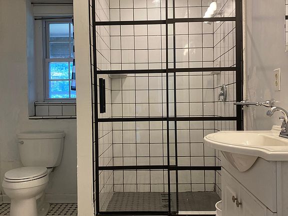 Brand new shower with custom tile.