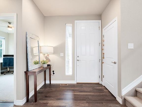 Front entrance. Door to the right leads to basement. To the left is a full bedroom (office), full bathroom and hall closet