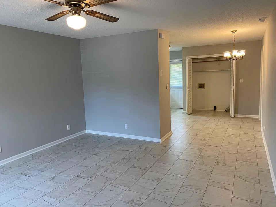 Living Room looking into Dining Area;
Utility Closet with Bi-fold Doors- has 
 Washer/Dryer Hook-Ups